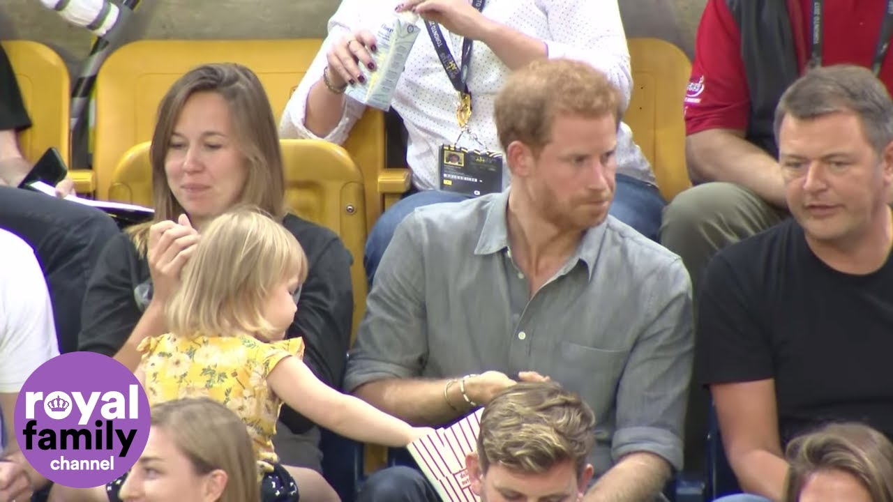 Sneaky toddler steals Prince Harry's popcorn